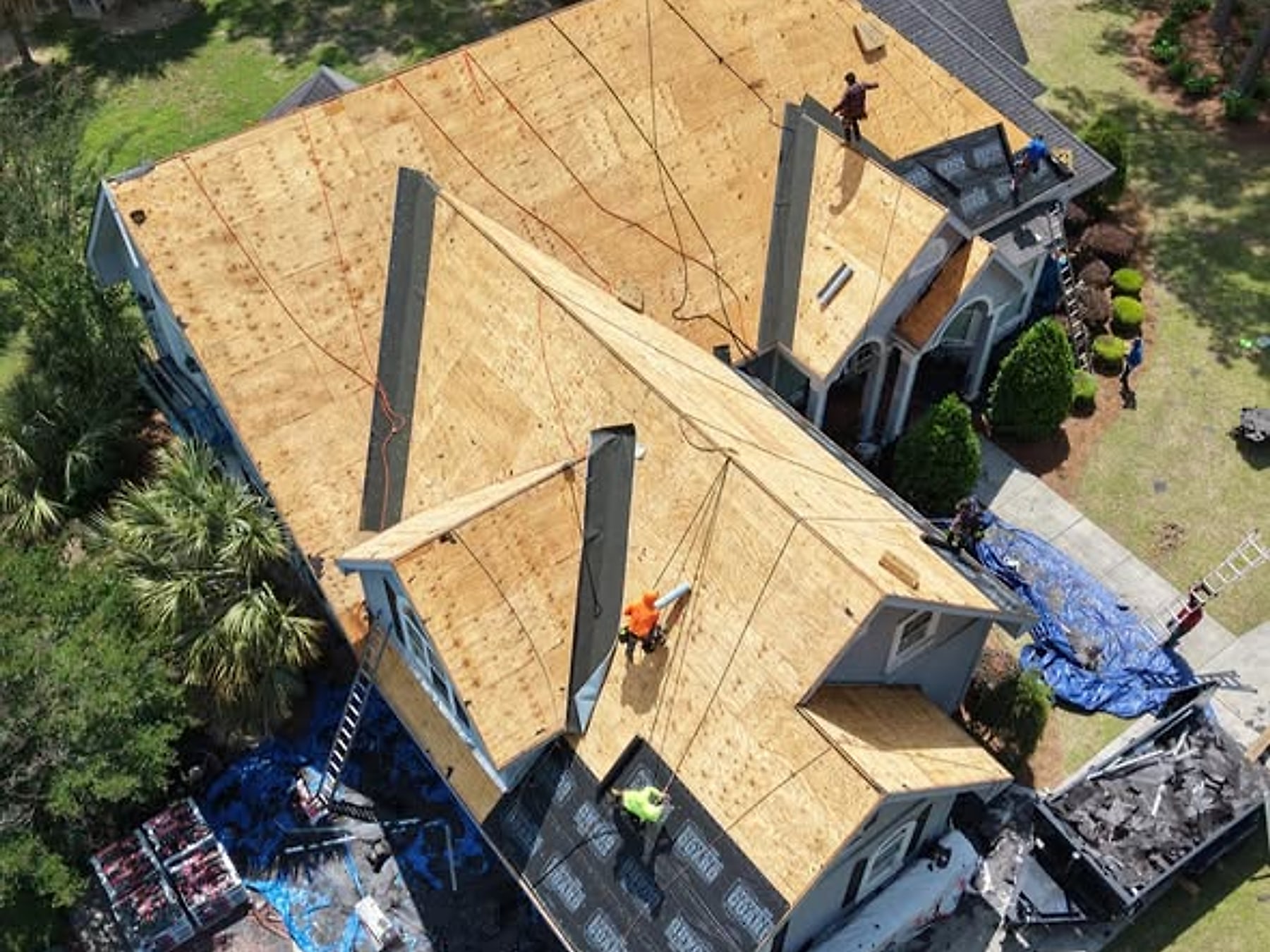 Tear-off & Decking — Old shingles off, decking inspected and repaired before anything goes back on.